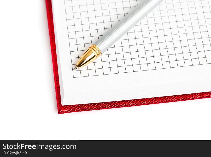 Red notebook with silver pen