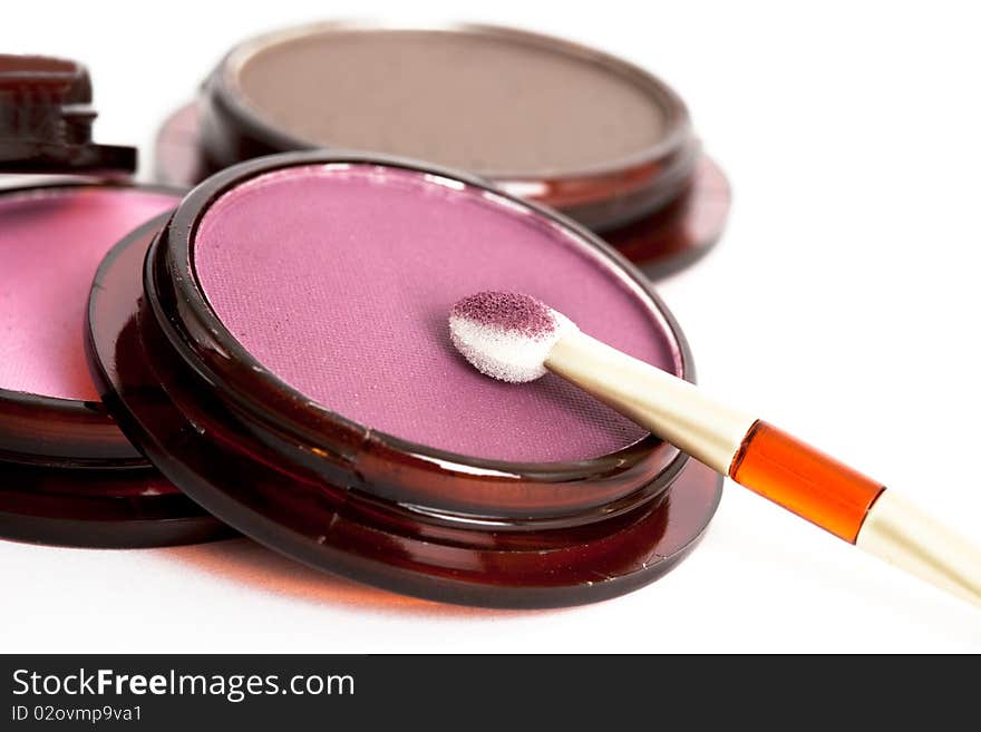 Make-up eyeshadows and cosmetic brush