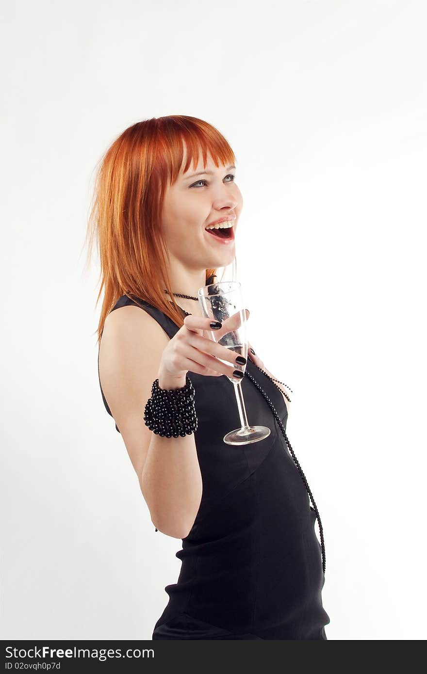 Beautiful red-haired girl lifts a toast, a glass with champagne