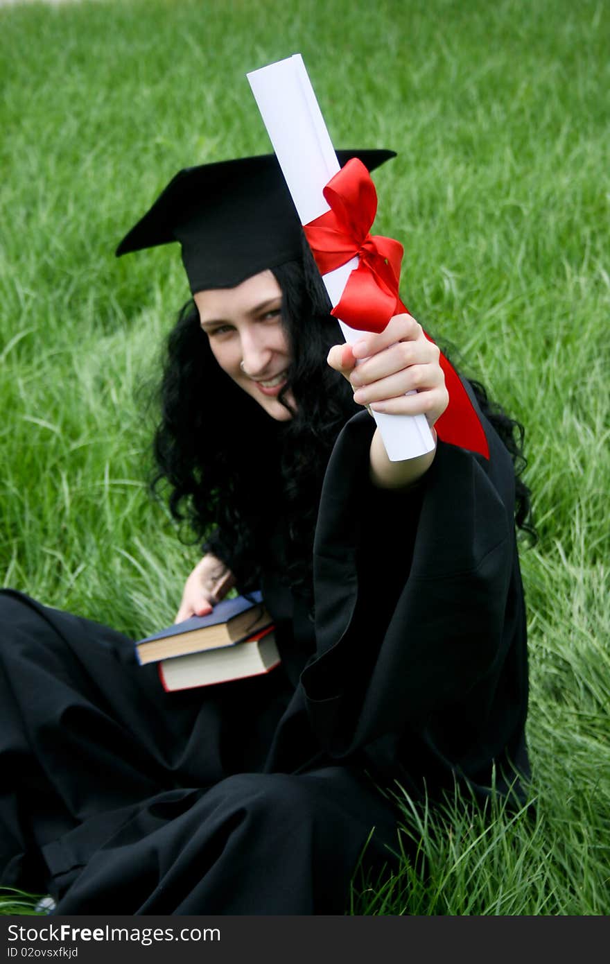 Smiling caucasian student with diploma