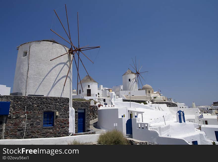 Windmills In Santorini Island