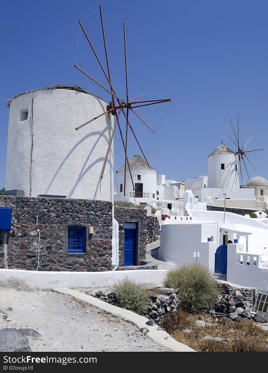 Windmills In Santorini Island