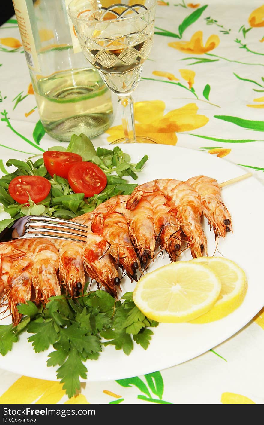 A dish with grilled shrimps