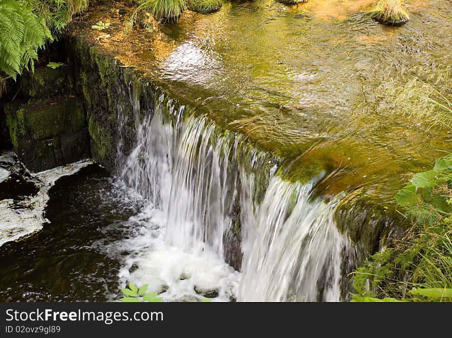 Sunshine,Fast flowing water in the mountain river.