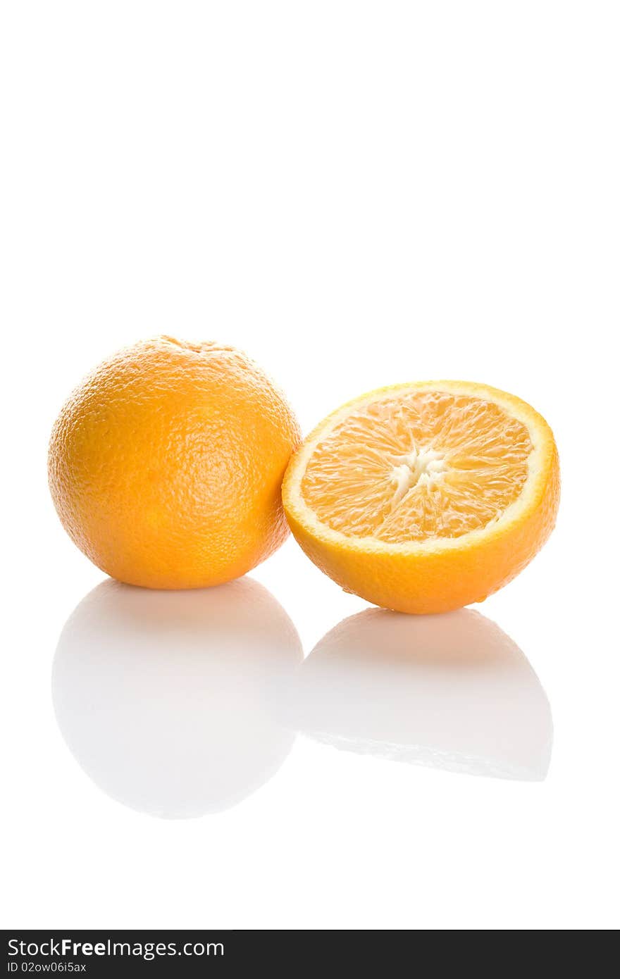 Two perfectly fresh oranges isolated on white. Two perfectly fresh oranges isolated on white