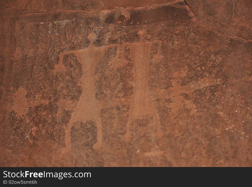 Images of people carved into a rock wall at Wadi Rum, a UNESCO World Heritage site in Jordan. Images of people carved into a rock wall at Wadi Rum, a UNESCO World Heritage site in Jordan.