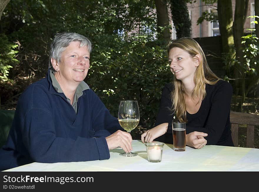 Mother And Daughter Drinking