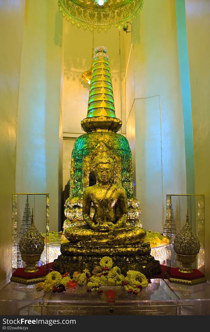 Golden image of Buddha and relic in the back. Golden image of Buddha and relic in the back