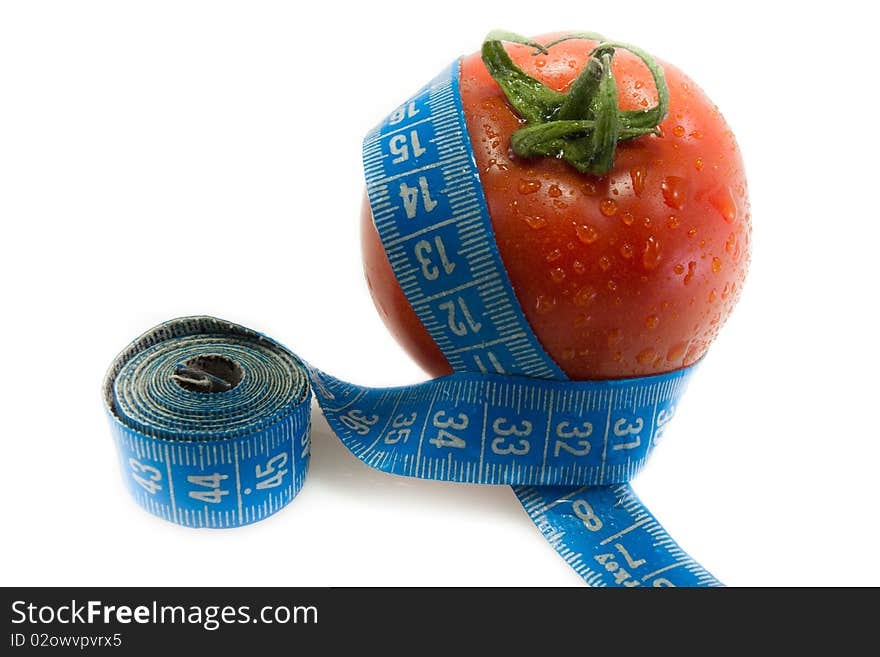 Red tomato with blue measurement tape and drops of water. Red tomato with blue measurement tape and drops of water