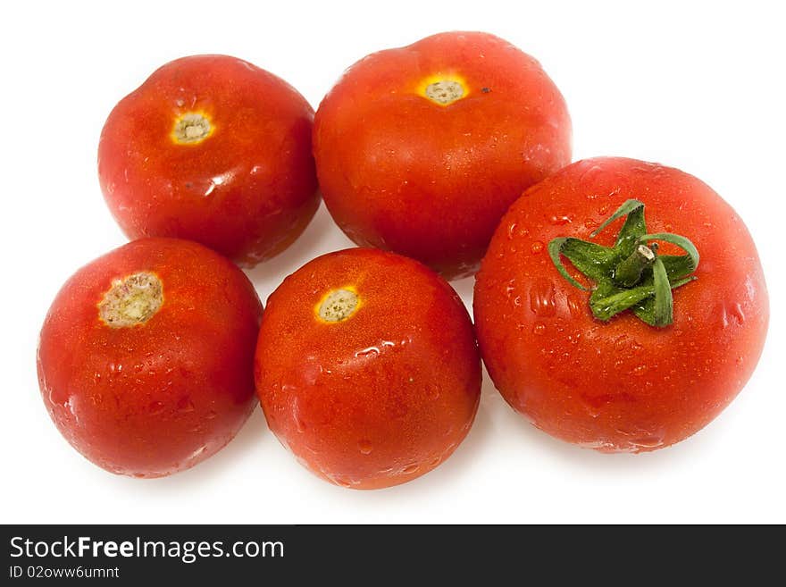 Juicy red tomatoes with water drops isolated on white. Juicy red tomatoes with water drops isolated on white