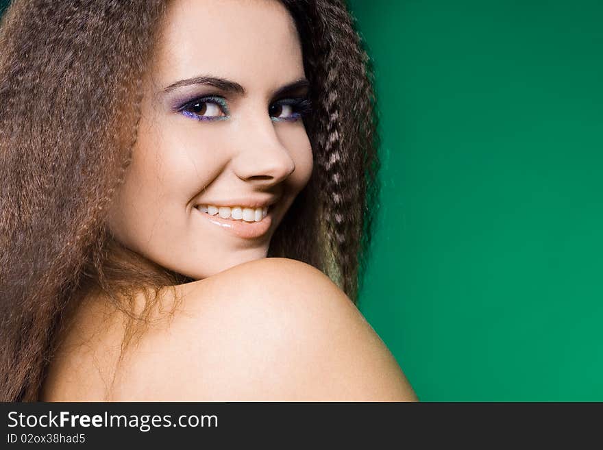 Beautiful woman on green background