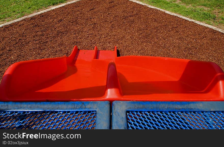 Playground slides on summer day looking downward