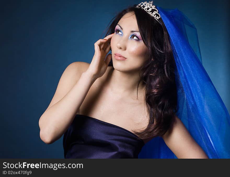 Beautiful girl with diamond crown and veil