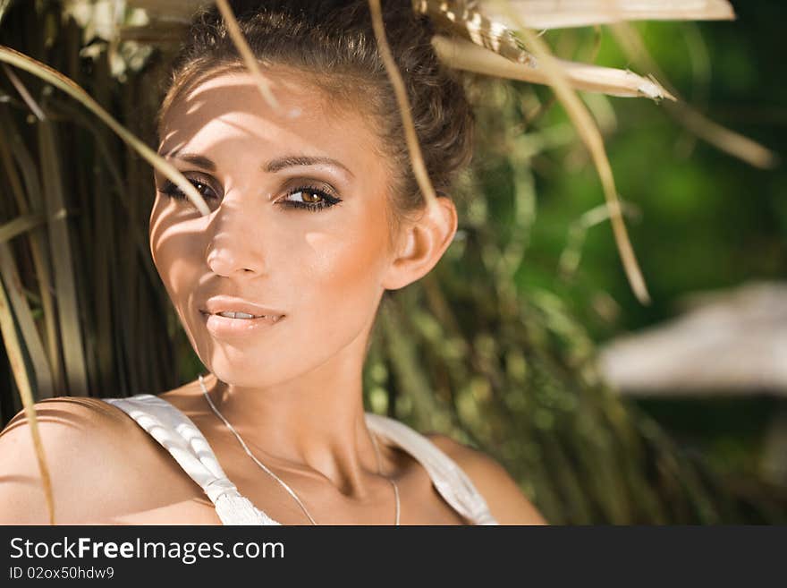 Beautiful woman near the haystack