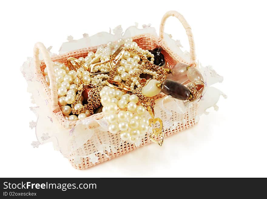 Female gold ornaments in a casket isolated on a white background