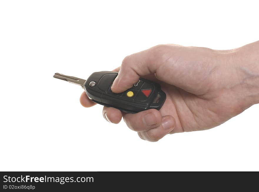 Men's hand with a car's key isolated over white