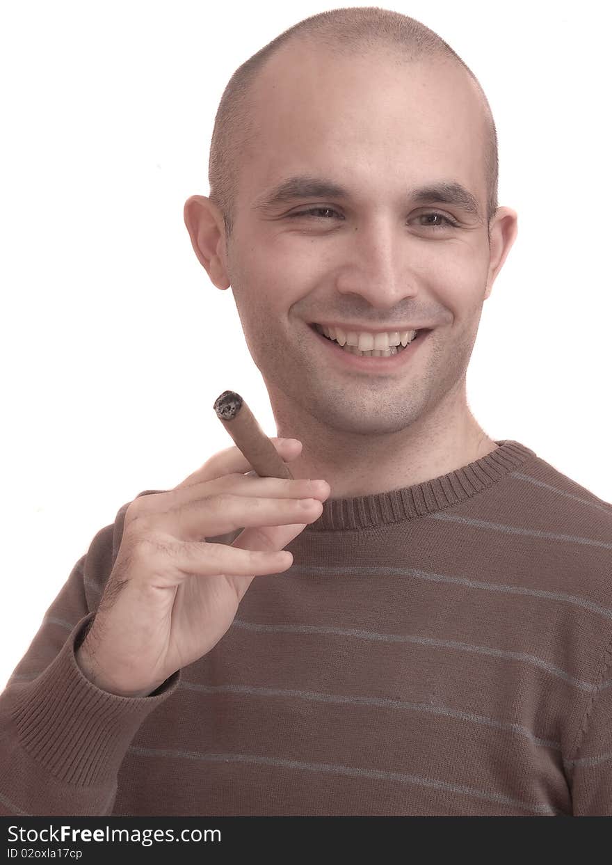 A young man smoking a big cigar. A young man smoking a big cigar