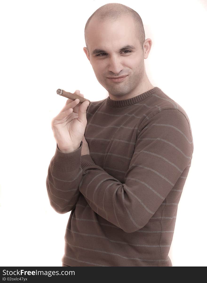 A young man smoking a big cigar. A young man smoking a big cigar