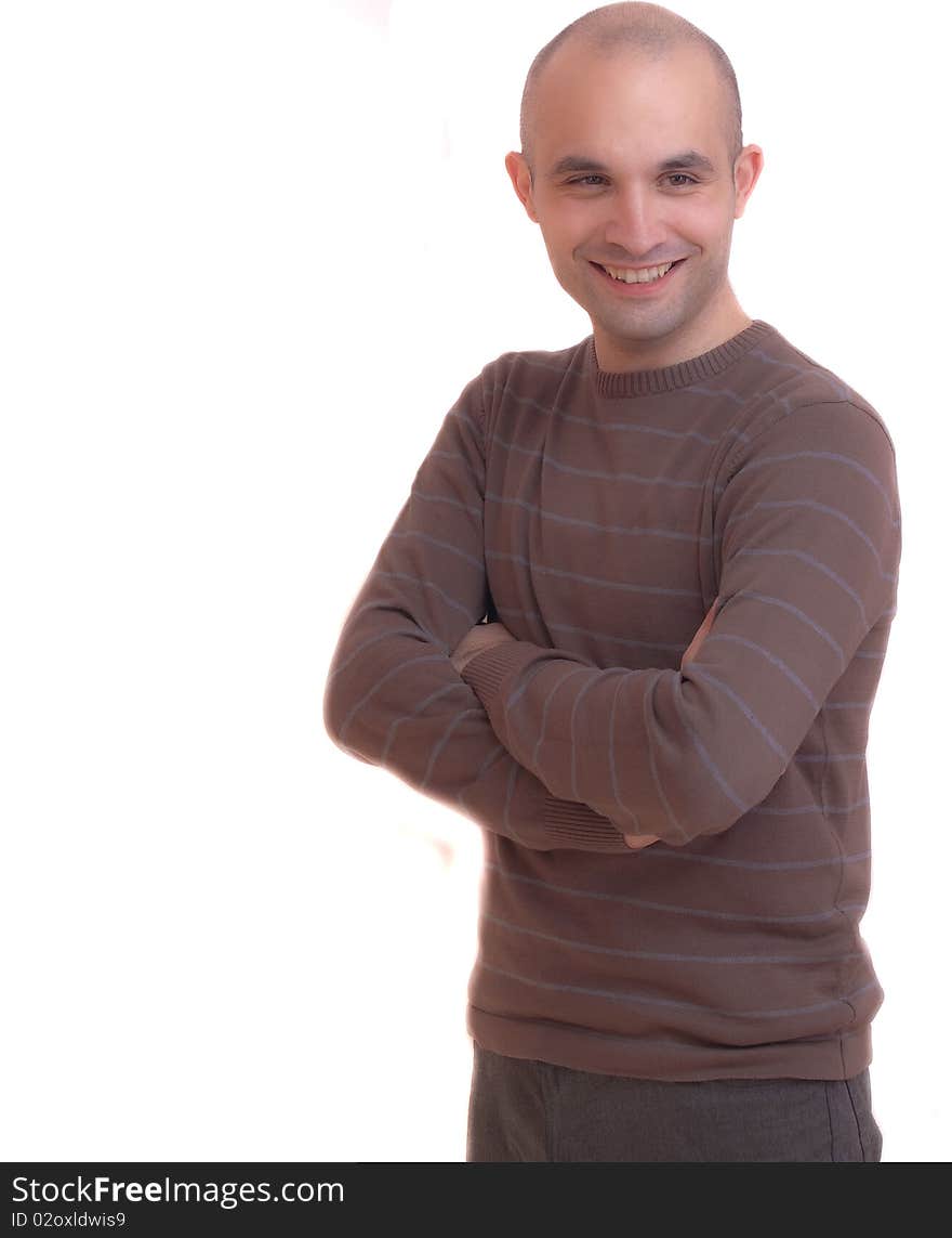 A Young man standing against a white background