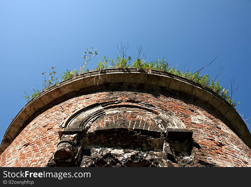 Old brick tower against the dark blue sky. Old brick tower against the dark blue sky.