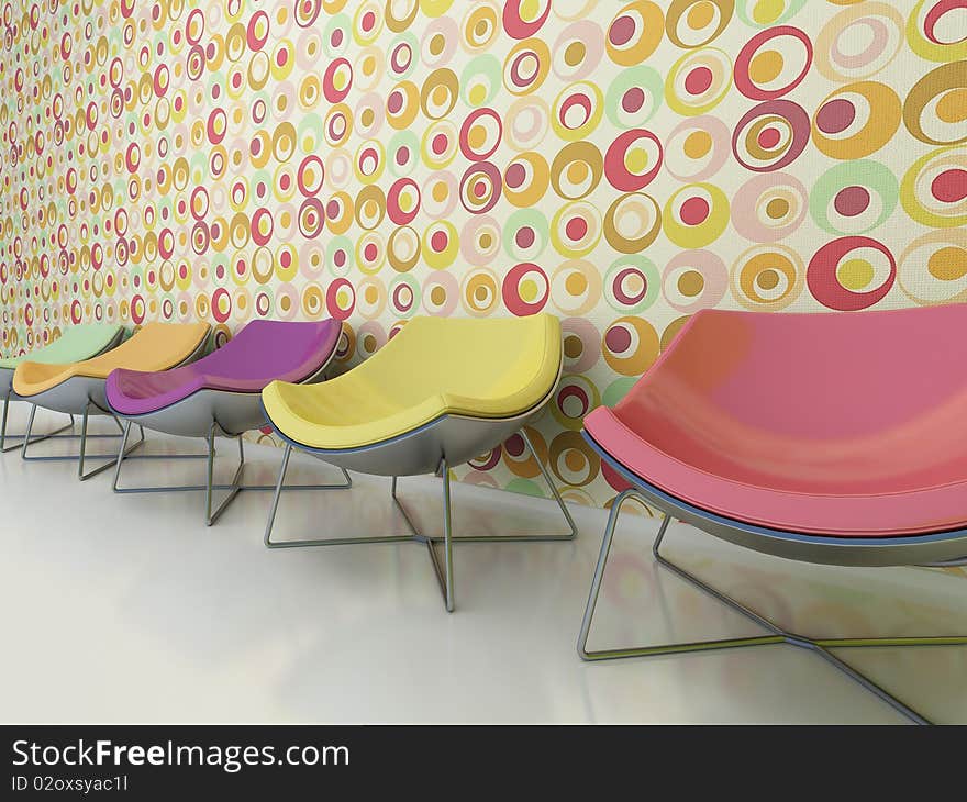 Colorful chairs stand against the wall.