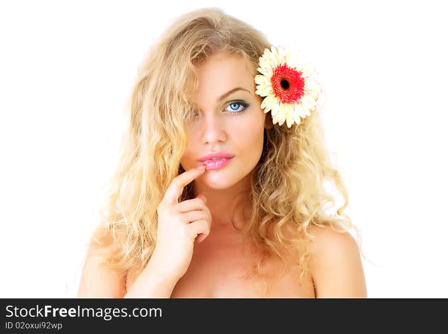 Beautiful girl and gerbera on a light background