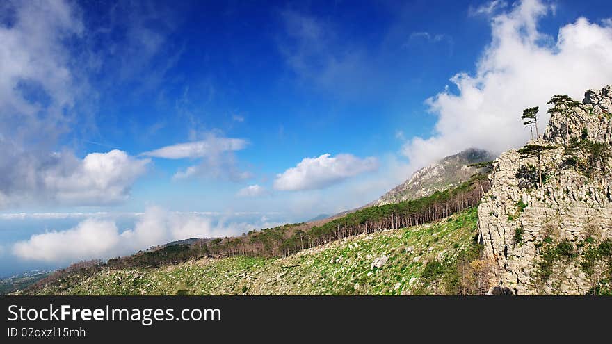 Landscape with high mountain and long declivity. Natural composition.