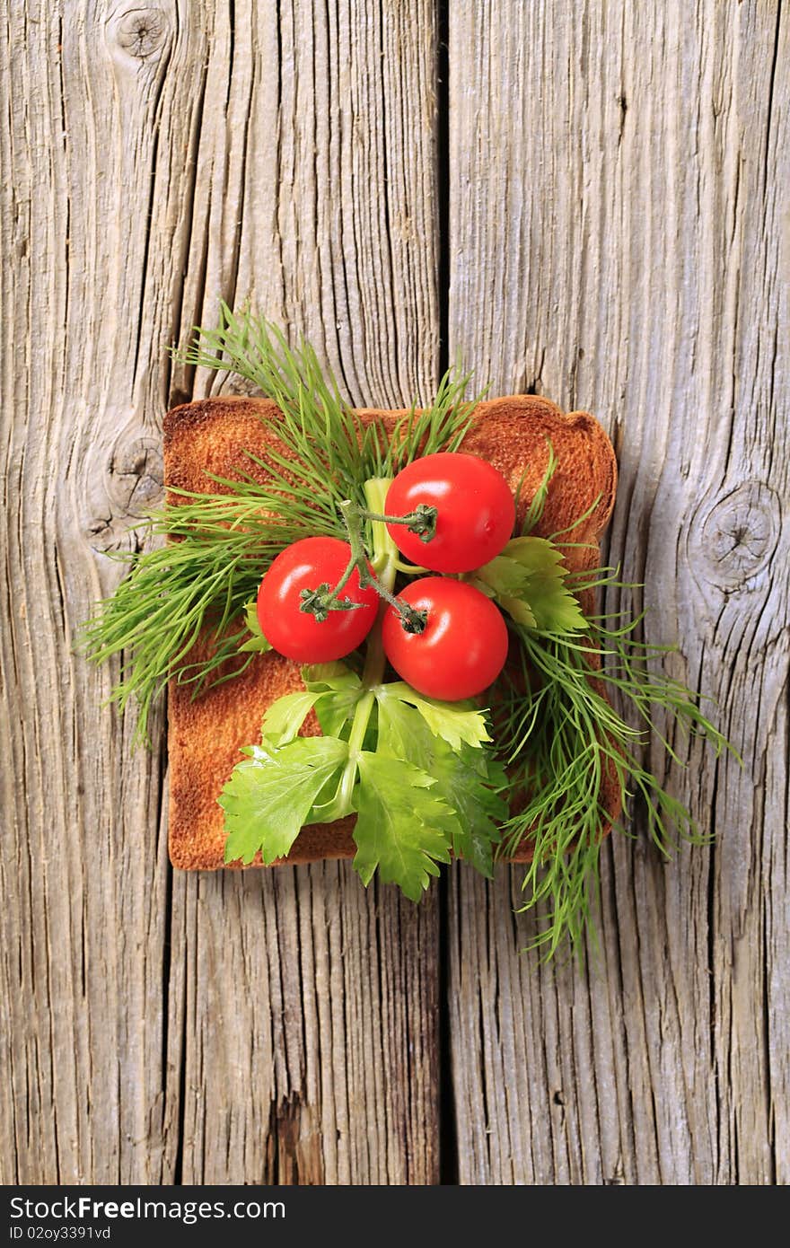 Piece of toast with vegetable topping - overhead