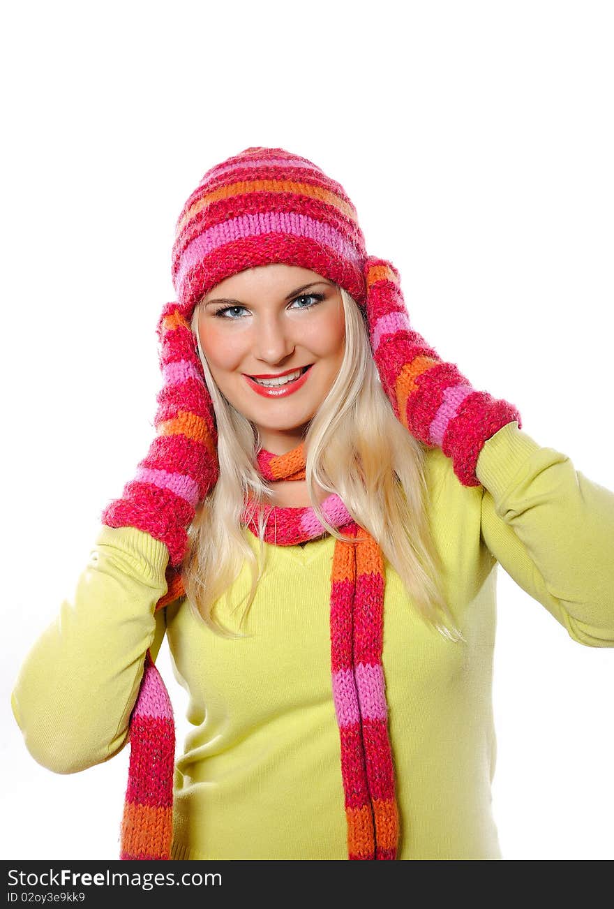 Seasonal portrait of pretty funny woman in hat and gloves smiling