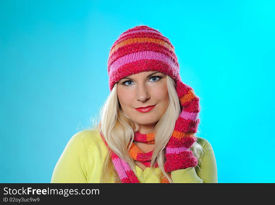 Seasonal portrait of pretty funny woman in hat and gloves smiling