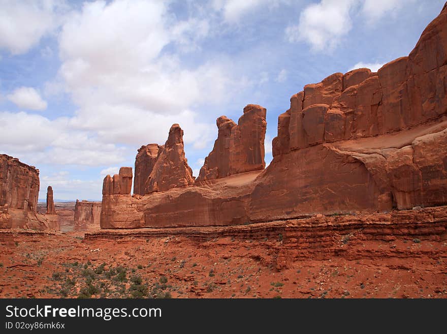 The stunning red rock walls of Park Avenue welcome visitors to Arches National Park in southern Utah's red rock country.