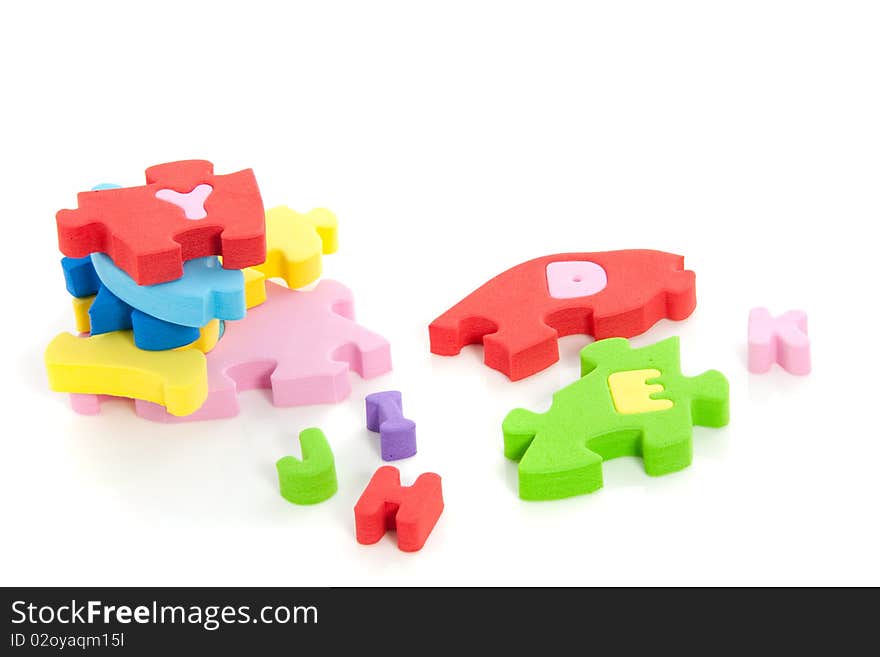 Stack of colorful puzzle pieces isolated over a white background. Stack of colorful puzzle pieces isolated over a white background