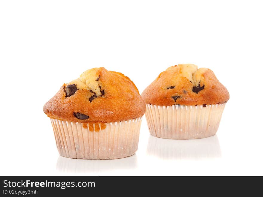 Two tasteful muffins with chocolate isolated over white