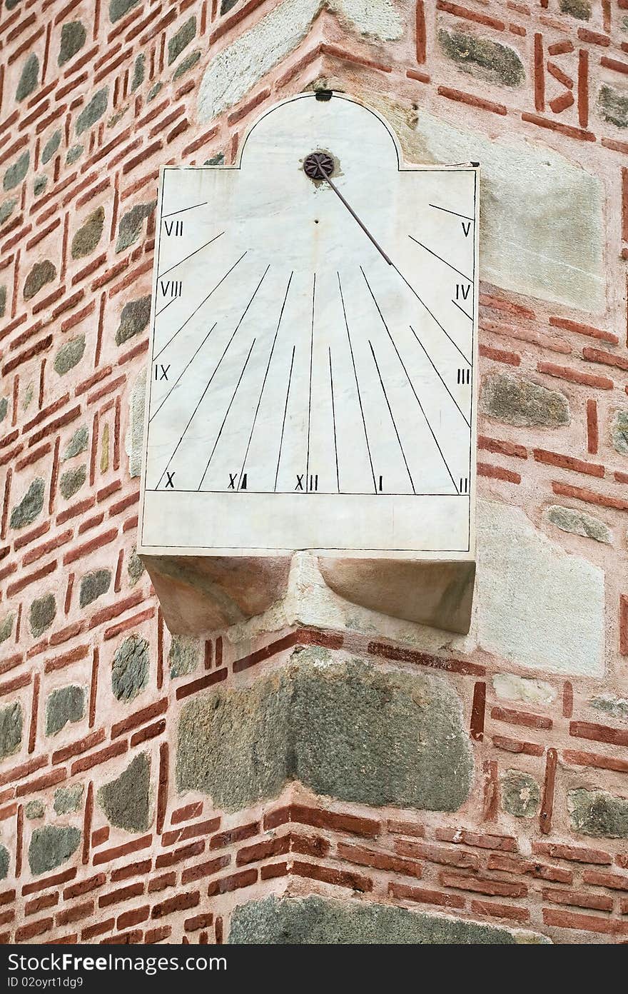 Sundial on a old wall