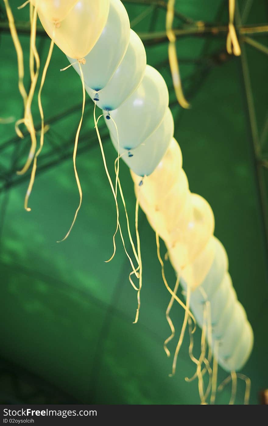 Row of blue and yellow baloons with ribbons. Row of blue and yellow baloons with ribbons