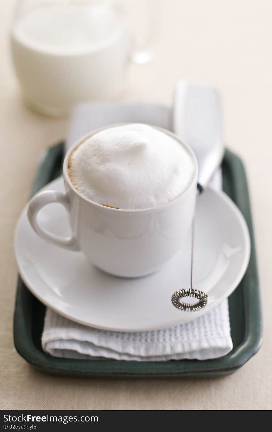 Fresh cappuccino with milk and sugar close up shoot