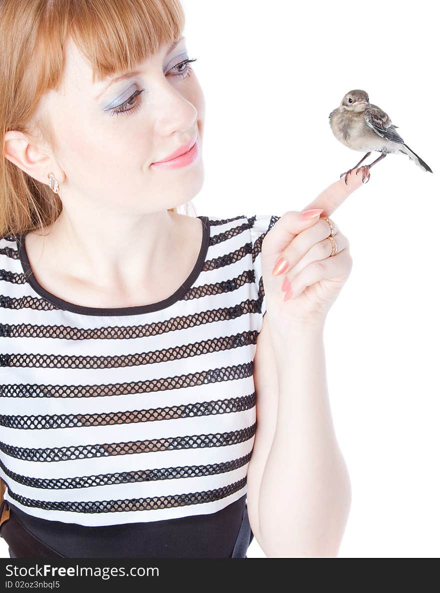 Nestling of bird (wagtail) on hand