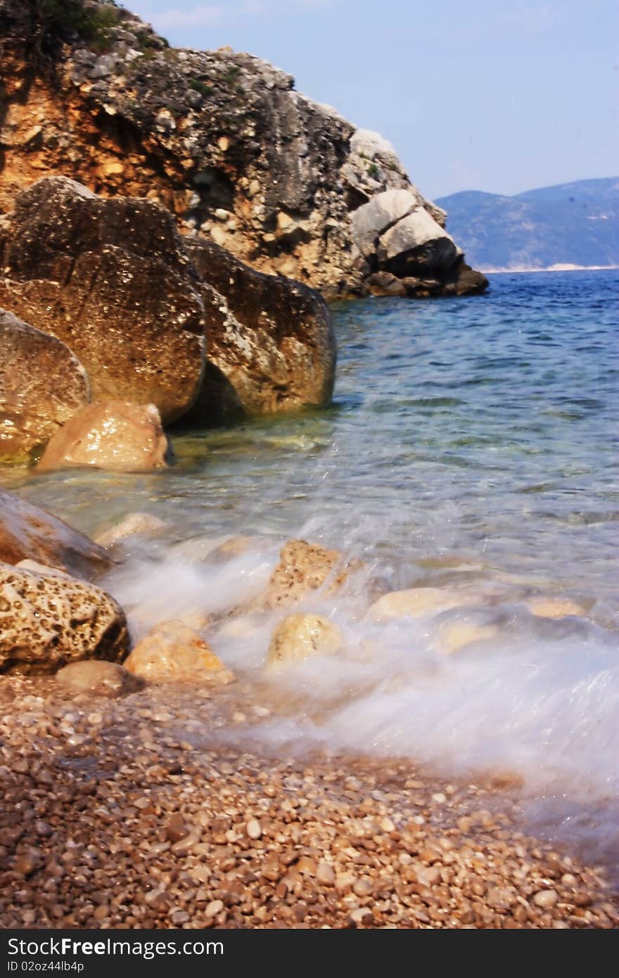 Sea coast with clear water, rocks and cliffs. Sea coast with clear water, rocks and cliffs