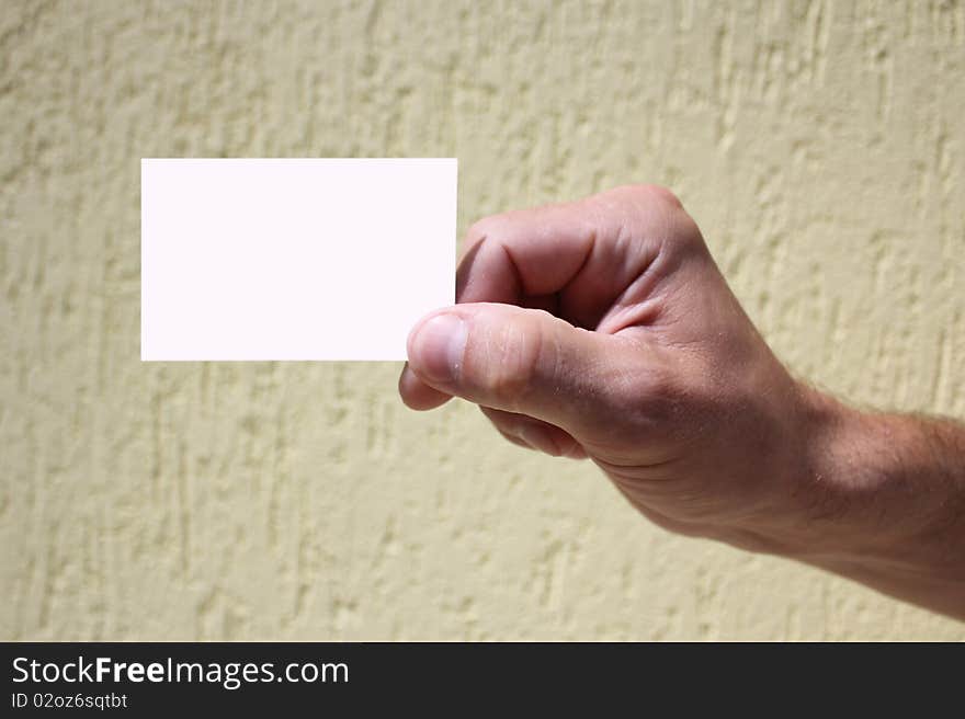 White card in a man's hand