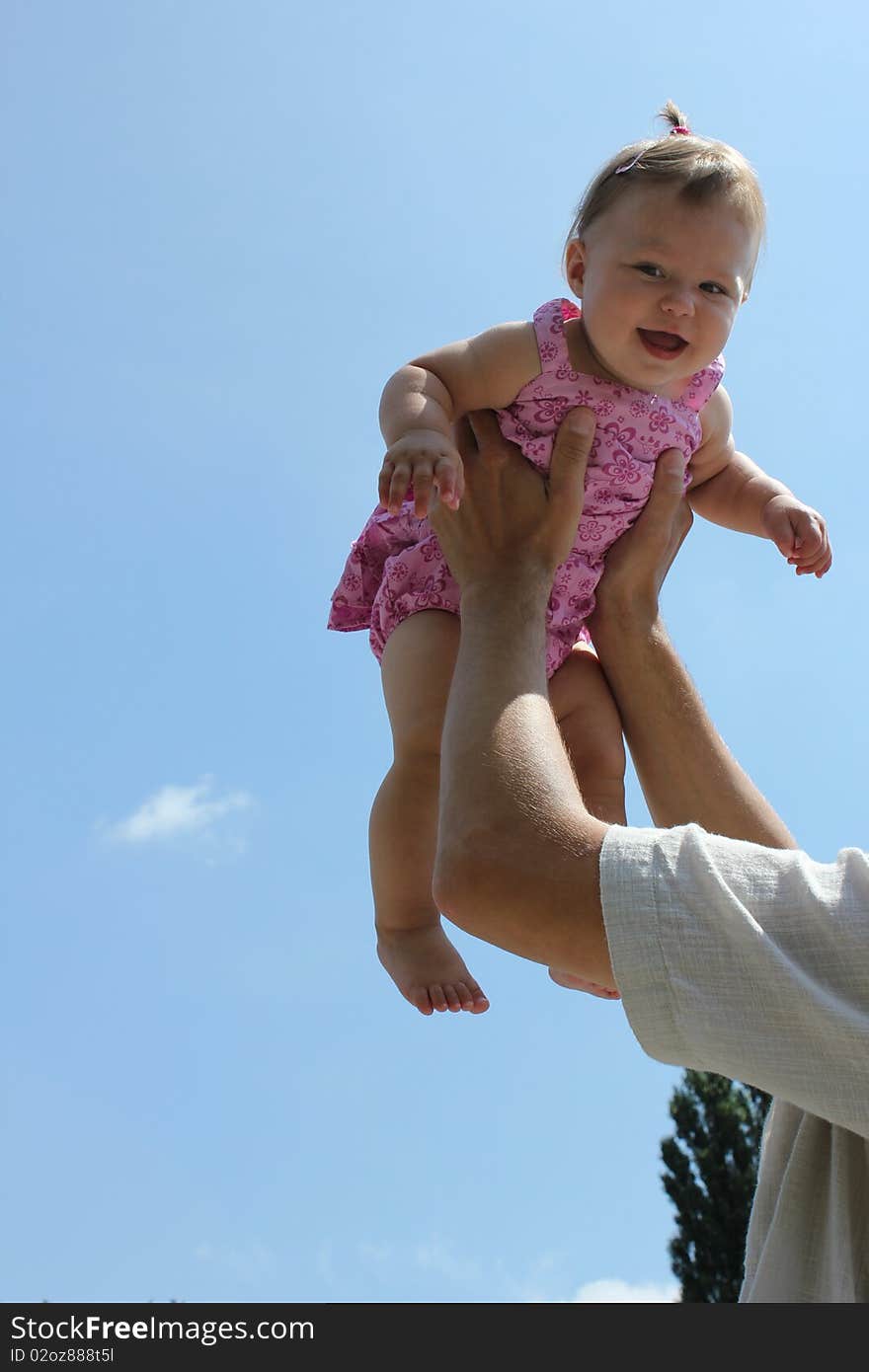 Child against the blue sky