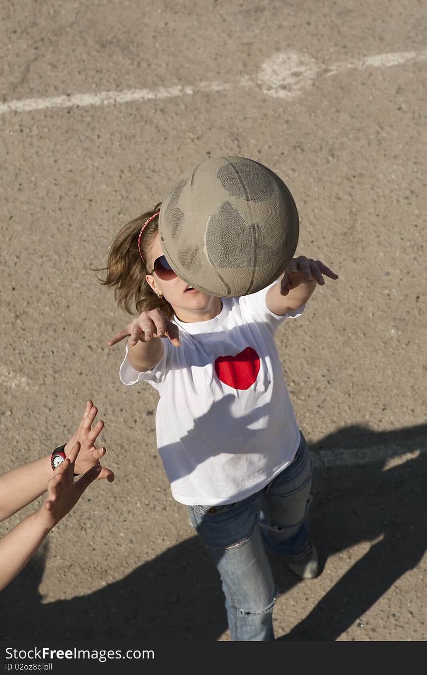 Basketball girl player throwing the ball in the basket outdoor. Basketball girl player throwing the ball in the basket outdoor