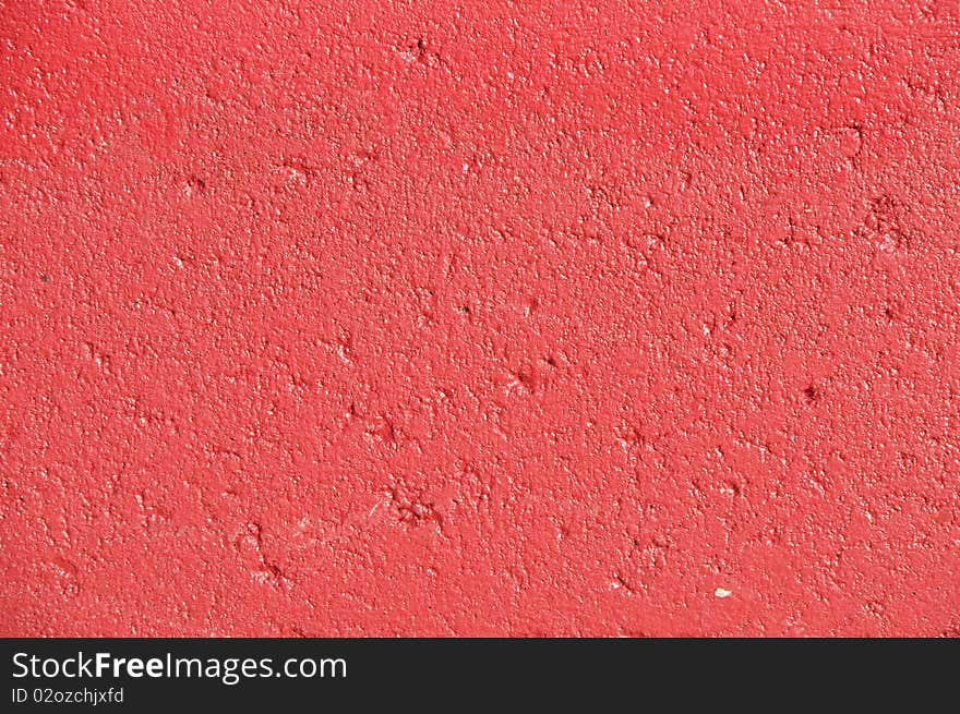 Red paint on concrete surface. Red paint on concrete surface.