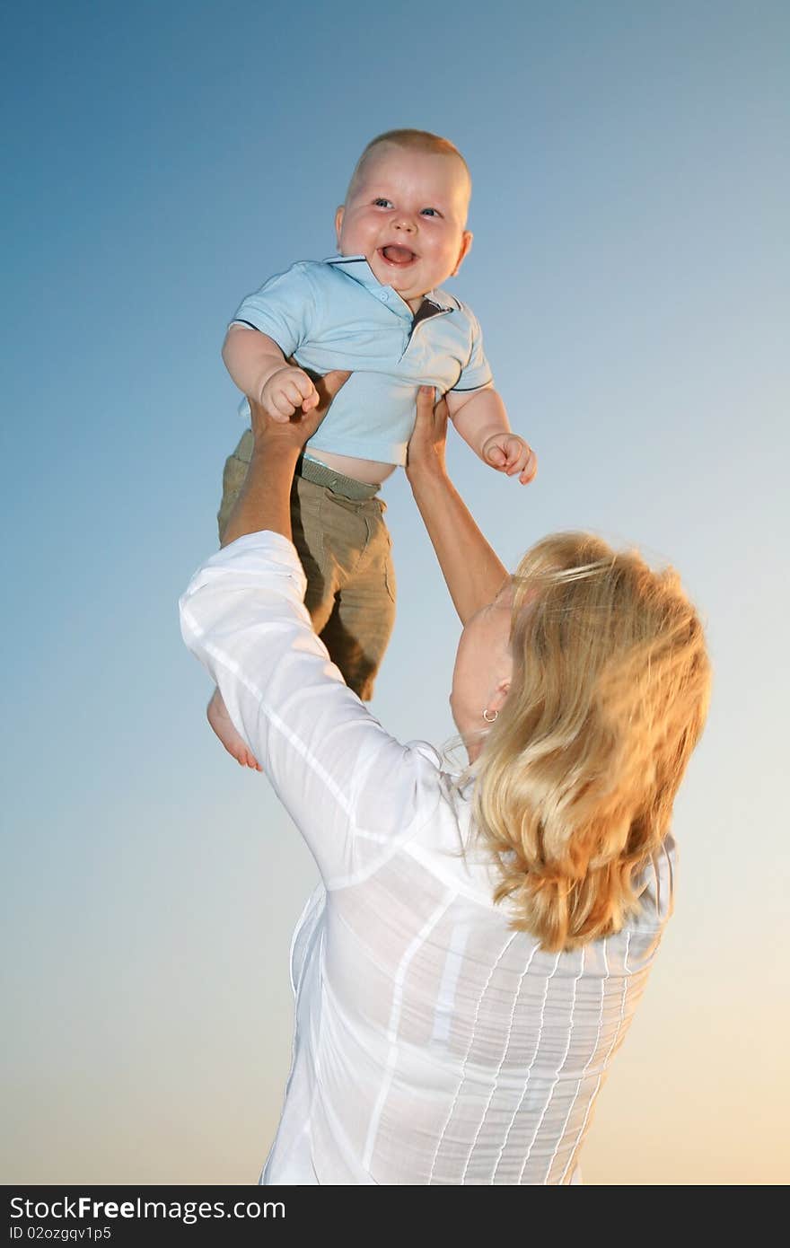 Happy smiling child with his mother. Happy smiling child with his mother