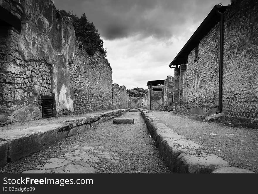 Rare, empty street in Pompeii, Italy, black and white