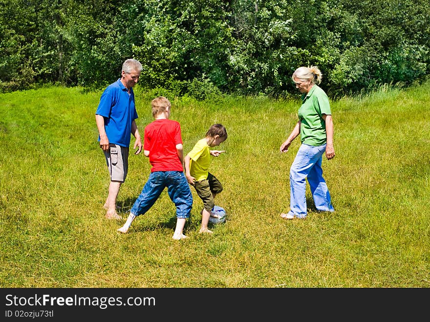 Elderly couple with their grandchildren