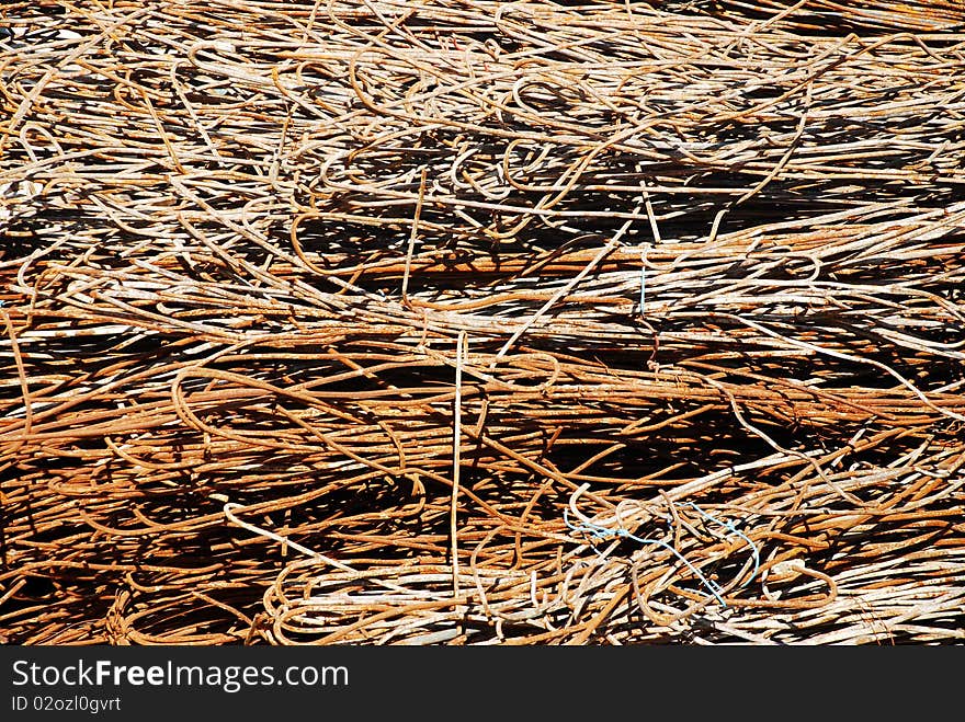 Rusty scrap bars at a construction site. Rusty scrap bars at a construction site.