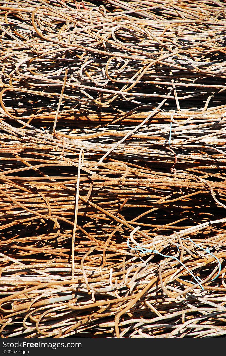 Rusty scrap bars at a construction site. Rusty scrap bars at a construction site.