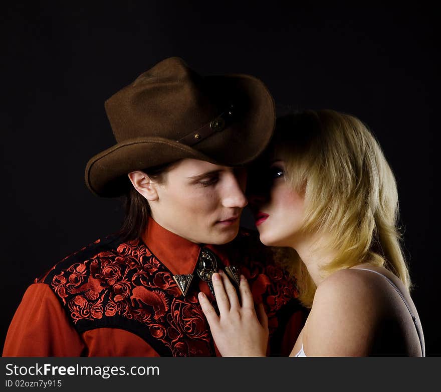 Young boy and girl studio shot cowboy style. Young boy and girl studio shot cowboy style