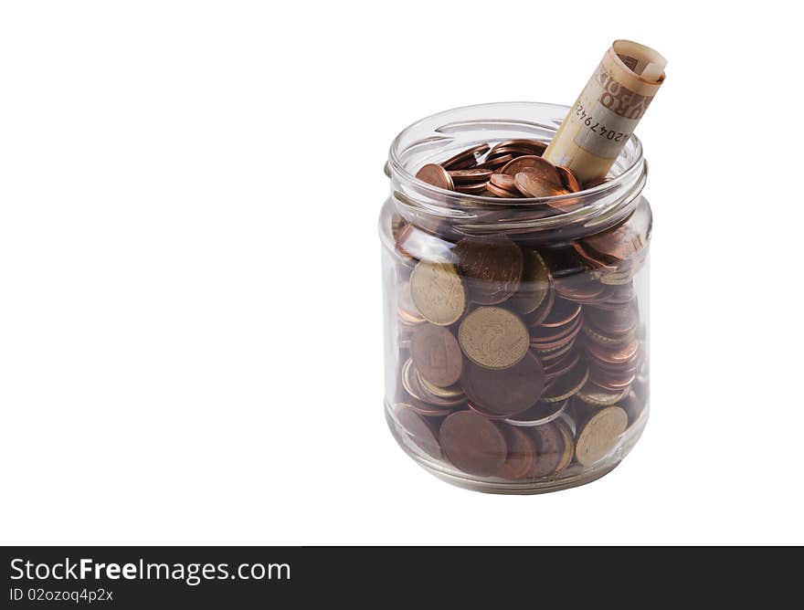 Coins and a € 50 note in a glass jar on white background Isolated