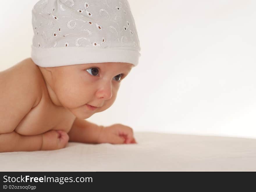 Portrait of a beautiful newborn baby on a white background